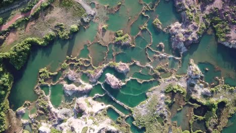 Aerial-top-down-view-blue-water-lake-in-Frog-Hill,-Guar-Petai,-Penang.